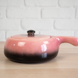 May include: A set of three ceramic mugs with a speckled, matte finish. The mugs are in shades of cream, light gray, and dark gray. Each mug has a simple, minimalist design, perfect for coffee or tea.