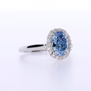 1.94 Carat Oval Fancy Vivid Blue Diamond, Rare Color, Diamond Halo Setting,18k White Gold Anniversary Ring, IGI Certified Rings In Stock image 9