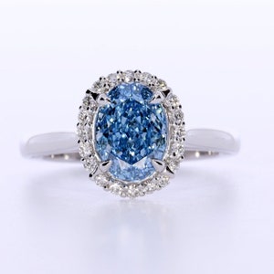 1.94 Carat Oval Fancy Vivid Blue Diamond, Rare Color, Diamond Halo Setting,18k White Gold Anniversary Ring, IGI Certified Rings In Stock image 1