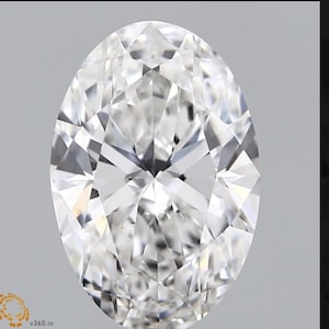 May include: A large, clear, oval-shaped diamond with many facets.