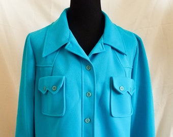 May include: A turquoise long-sleeved button-down shirt with two large flap pockets on the front.
