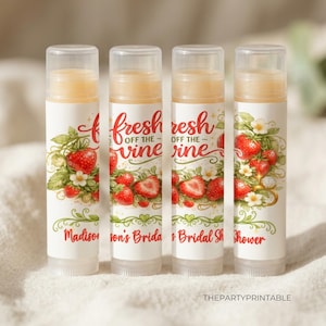 May include: Four lip balm tubes with clear caps. Each tube has a white label with a strawberry design and the text "fresh off the vine." The text "Madison's Bridal Shower" is also printed on the tubes.