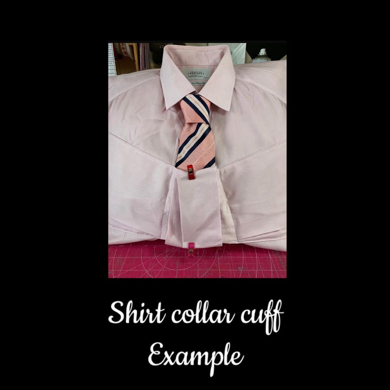 May include: A light pink dress shirt with a white collar and cuffs. A striped tie in pink, navy, and white is secured with a red clip. The text "Shirt collar cuff Example" is at the bottom.
