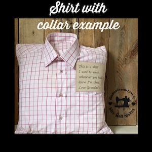 May include: A pillow shaped like a collared shirt with a pink and white plaid pattern. The shirt has a small tag with handwritten text. The text on the tag reads, "This is a shirt I used to wear, whenever you hold it know I'm there. Love Grandad x."