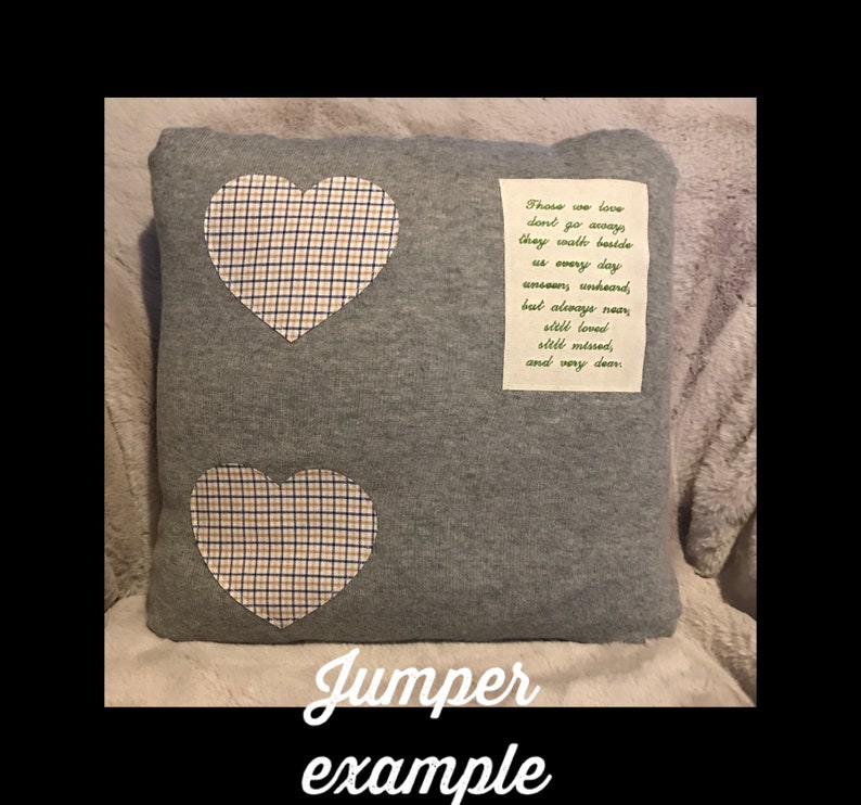 May include: A gray pillow with two heart-shaped patches made of a plaid fabric in blue, white, and tan. A rectangular patch with a poem is sewn on the pillow. The text "Jumper example" is at the bottom.