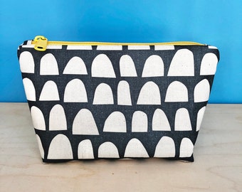 Flat bottomed pouch with black and white semi circle screen printed pattern
