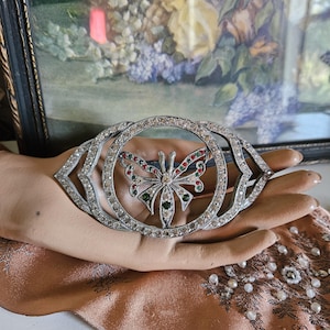 May include: A set of three ceramic mugs with a speckled, matte finish. The mugs are in shades of cream, light gray, and dark gray. Each mug has a simple, minimalist design, perfect for coffee or tea.