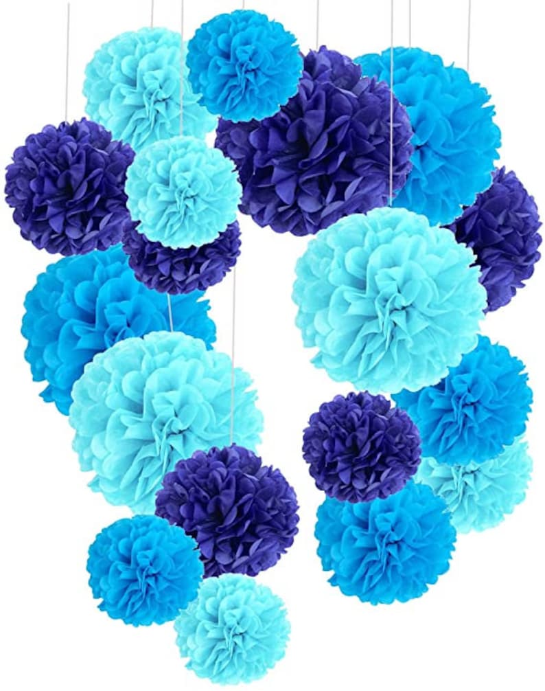 May include: A set of blue and purple tissue paper pom-poms, perfect for decorating a party or event.