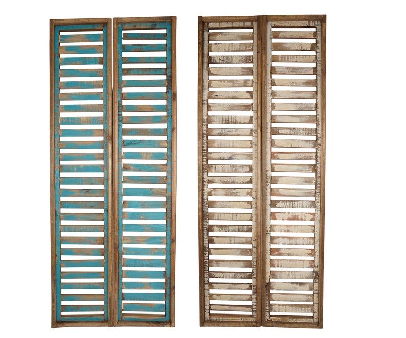 May include: Two sets of wooden shutters, each with two panels. One set is painted a light blue color, and the other set is painted a whitewashed color. The shutters are made of reclaimed wood and have a rustic look.