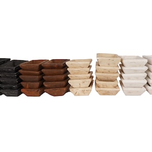 May include: A set of 30 small wooden bowls stacked in three rows of ten. The bowls are in three colors: black, brown, and white.