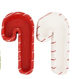 May include: Two wooden candy cane shaped bowls, one red with white stripes and one white with red stripes.