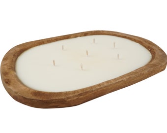May include: A wooden oval tray with a white candle inside. The candle has five wicks.