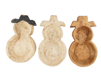 May include: Three wooden snowman-shaped bowls, each with a different finish. One is painted white with black accents, one is painted white with a distressed finish, and one is natural wood.