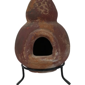 May include: A terracotta clay pot with a round opening, on a black metal stand. The pot has a rustic, aged appearance.