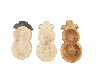 May include: Three wooden snowman-shaped bowls, each with a different finish. One is painted white, one is natural wood, and one has a black painted hat.
