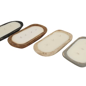 May include: Four wooden dough bowl candles in black, brown, white, and gray. Each candle has three wicks.