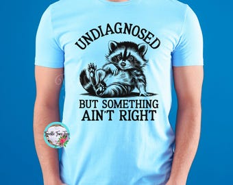 Camiseta "Sin diagnóstico pero algo no está bien", divertida camiseta de mapache, divertida camiseta de salud mental, divertida camiseta