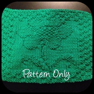 May include: A knitted green square with a raised shamrock design. The words "Pattern Only" are written in white script across the bottom of the square. The shamrock is the focal point of the design.