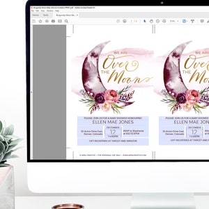 K&ouml;nnte beinhalten: Ein digitales Bild einer Babyparty-Einladung mit einer Aquarell-Illustration eines Halbmondes mit floralen Akzenten. Der Text "We are over the moon" ist in goldener Schrift geschrieben. Die Einladung enth&auml;lt den Namen Ellen Mae Jones, das Datum 12. Dezember, die Uhrzeit 13:00 Uhr und den Ort 35 Acton Drive East, Denver, Colorado. Die Einladung enth&auml;lt auch eine RSVP-Nummer und Informationen &uuml;ber Geschenkregister bei Target und Amazon.
