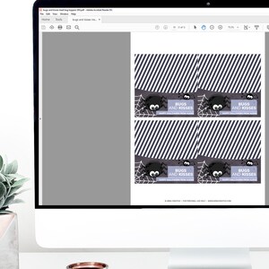 May include: A computer monitor displaying a PDF file with four printable Halloween treat bag toppers. Each topper features a black spider, a white web, diagonal stripes, and the text BUGS AND KISSES HAPPY HALLOWEEN FROM ALEXIS.