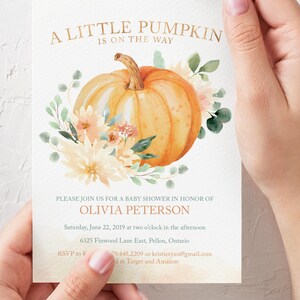May include: A baby shower invitation featuring a watercolour illustration of a pumpkin and flowers. The text reads "A Little Pumpkin is on the Way" and includes the name Olivia Peterson, the date and time of the shower, and the address. RSVP information is also provided.