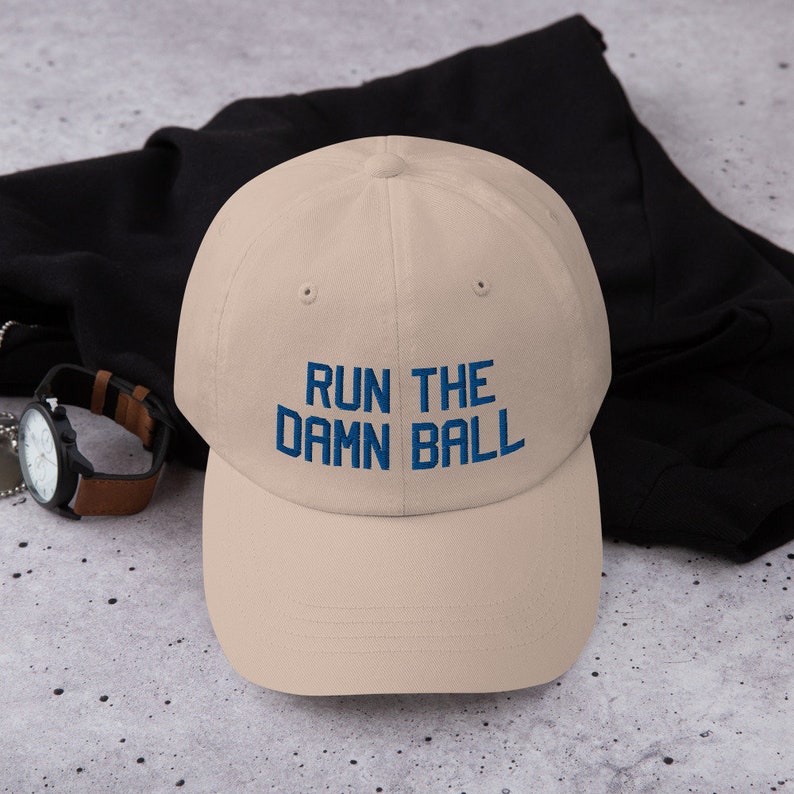 Run the damn ball hat Indianapolis Colts fan hat Quarterback Jacoby Brissett hat beige color front view