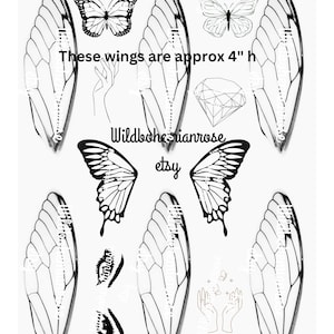 May include: Set of eight black and white butterfly wings, each measuring approximately 4 inches in height. The wings are outlined in black and have a delicate, intricate design. The text "These wings are approx 4" h" and "Wildbohemianrose etsy" is also included in the image.