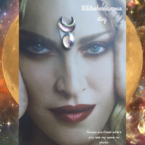 May include: A close-up of a face with a crescent moon and oval-shaped crystal forehead jewelry. The image has the text "Wildbohemianrose etsy" and "Always purchase where you see my name on photo."