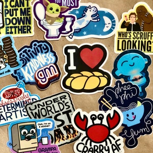 May include: A collection of colorful stickers with various designs and text. Stickers include a cartoon Baby Yoda on a toilet, a cow in space, and the text "Wash Your Hands You Must." Other stickers feature phrases like "Crabby AF" and "I Love Challah."
