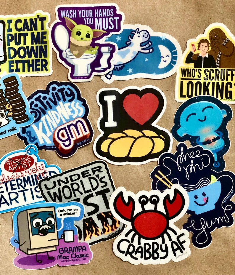 May include: A collection of colorful stickers with various designs and text. Stickers include a cartoon Baby Yoda on a toilet, a cow in space, and the text "Wash Your Hands You Must." Other stickers feature phrases like "Crabby AF" and "I Love Challah."