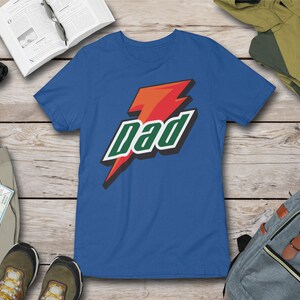 May include: A royal blue t-shirt with a red lightning bolt and the word "Dad" in green letters.