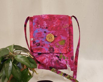 Crossbody cotton bag, hot pink, purple and green, oh my! Purple lining, 2 inside pockets, button closure, 51" strap