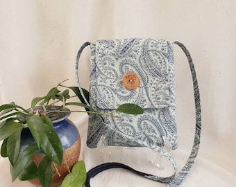 Crossbody cotton bag, Paisley blue-gray on soft teal background with dark blue lining, 2 inside pockets, button closure, 51" strap