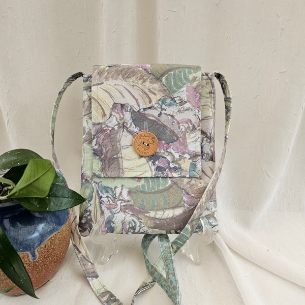 Crossbody bag. A "Nurtured Garden" of calming, soft, muted greens, mauves, and yellows by fabric designer Denise Burkitt