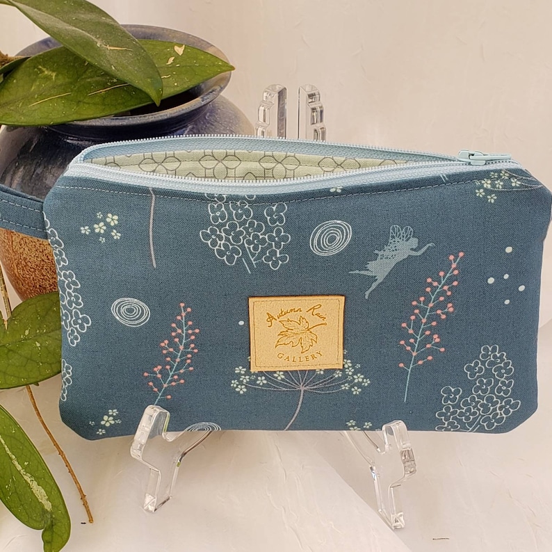 Zippered 8 x 5 clutchwristlet licensecredit cardscash etc fits newer 9+ phones Riley Blake Fairy Edith Wildflowers with mint lining