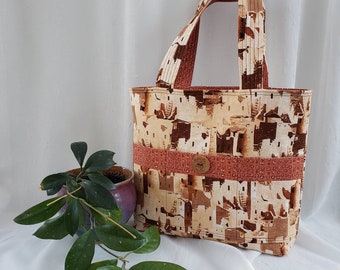 Reversible cotton tote, southwest cliff dwelling design outside, red clay colored inside, quilted 23" straps, total of 6 pockets