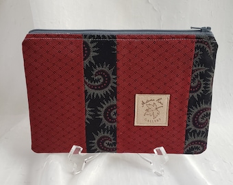 Zippered clutch style pouch, makeup/toiletry bag, bridesmaid gift, pencil case in black & red, black lining.