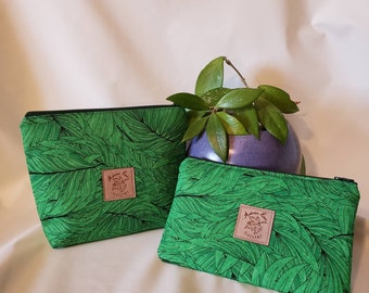 Matching pouches - green tropical leaf. Two styles - stand-up and clutch style pouch.  Makeup bag and/or organization/utility pouches