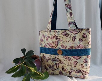 CLEARANCE Reversible cotton tote, light yellow batik with purple ferns outside, blue inside, 6 pockets, 23-inch quilted straps