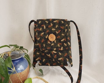 Crossbody cotton bag, Pinecones of rust & beige on dark green, beige lining, 2 inside pockets, button closure, 51" strap