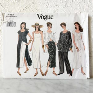 May include: Vogue pattern envelope showing illustrations of five women's fashion designs. The designs include dresses, tops, and trousers. The envelope is white with the Vogue logo and pattern details.