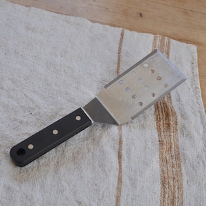 Professional Grade Stainless Steel Spatula Black Handle and Blade Edges and Drain Holes