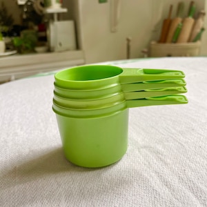 Four Vintage Tupperware Measuring Cups in Green