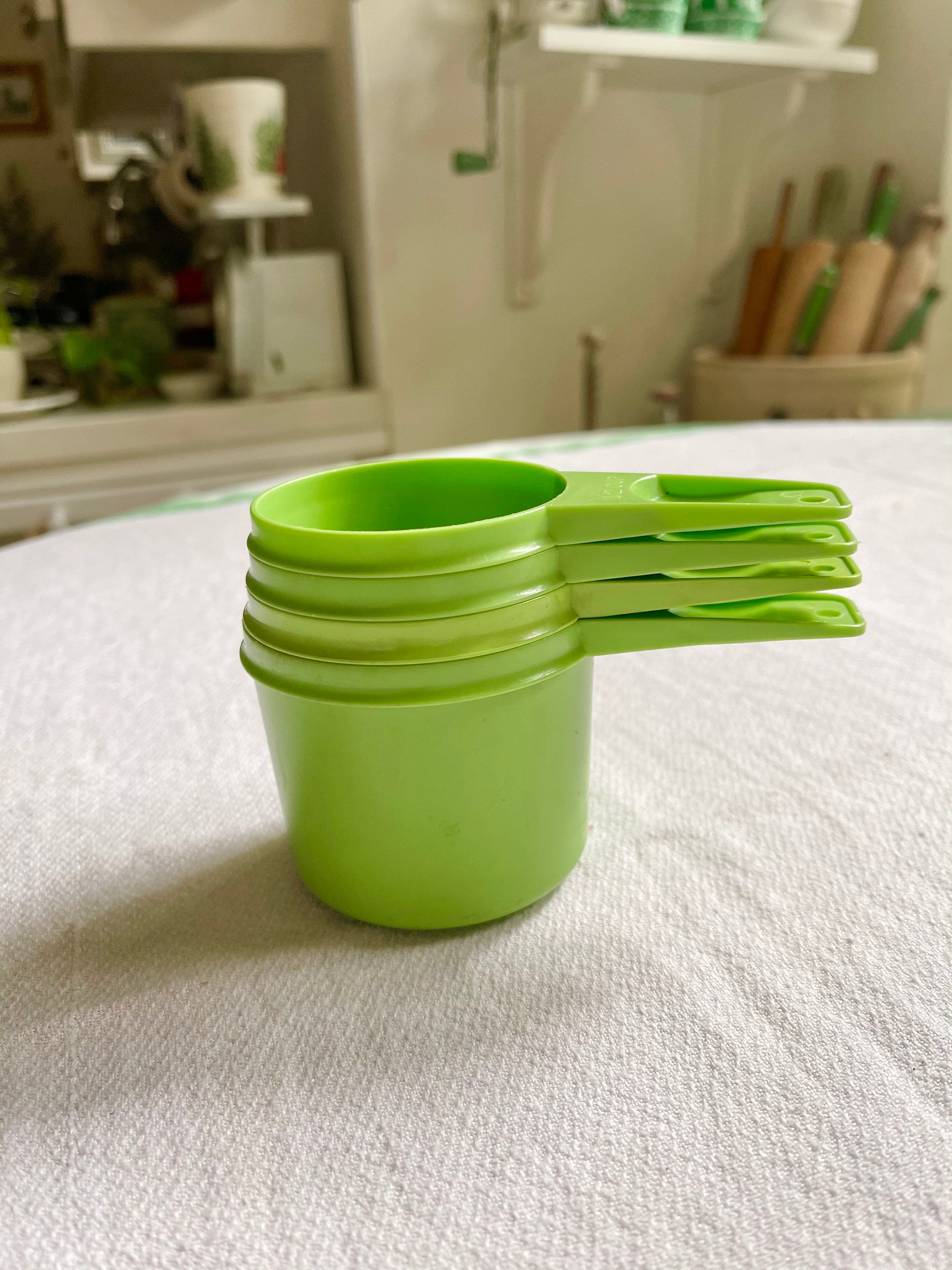Four Vintage Tupperware Measuring Cups in Green 