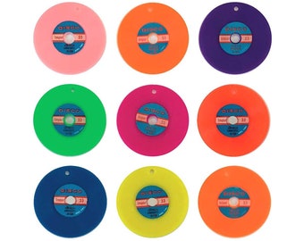 May include: Nine colorful plastic records with a blue and white label that says "DISCO" and "Import 33" in a circle. The records are in the colors pink, orange, purple, green, magenta, yellow, and orange.