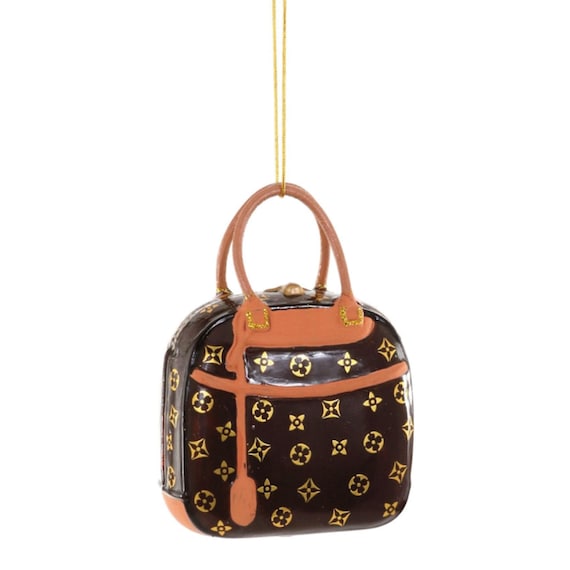 How much does it cost Louis Vuitton or Hermès to make one handbag