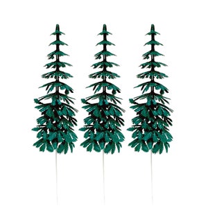 May include: Three green plastic pine trees on white sticks, perfect for adding a touch of nature to your craft projects.