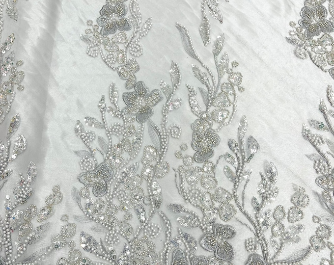 Silver metallic floral embroider and heavy beaded on a mesh lace fabric-sold by the yard-