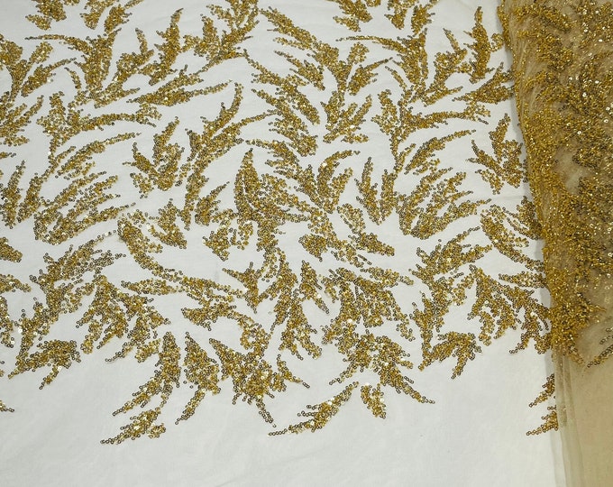 Gold elegant hand beaded design embroider on a mesh lace-prom-sold by the yard.