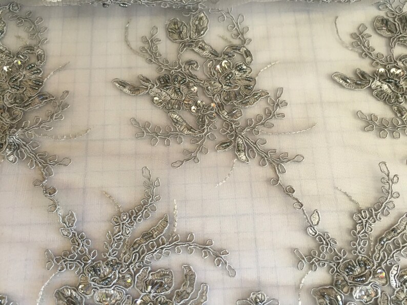 Gray marvy flower design embroider with glass beads and sequins on a mesh lace yd